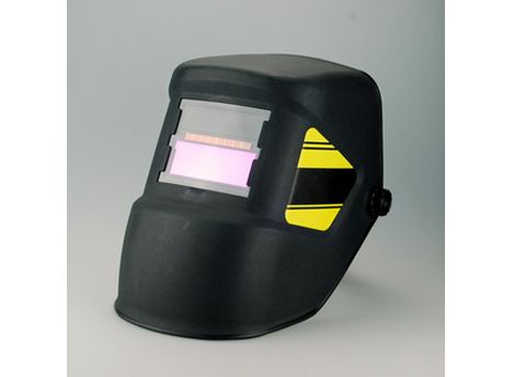 Auto-dardening welding helmet