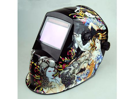 Auto-darkening welding helmet